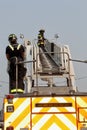 Firemen at work with smoke in background