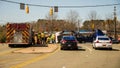 Firemen and workmen with overturned logging truck