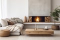 Fireplace against white sofa and rustic wooden coffee table. Scandinavian style home interior design of modern living room Royalty Free Stock Photo