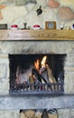 Fireplace with burning firewoods Royalty Free Stock Photo