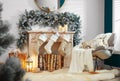 Fireplace with Christmas stockings in room interior Royalty Free Stock Photo