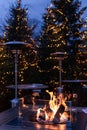 Fireplace and christmas trees with blurred lights