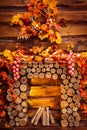 Fireplace collected from logs in room with wooden walls