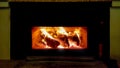 Fireplace fire logs woods dark winter season Royalty Free Stock Photo