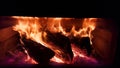 Fireplace fire logs woods dark winter season Royalty Free Stock Photo