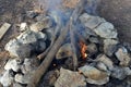 Campsite with campfire. Gray and brown big stones and wood for a bonfire in a fireplace