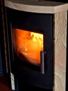 fireplace heating, made of metal and tiles of cut stone with stains. by the