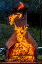 Fireplace with huge fire and devil from flames revealed