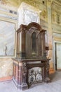 Fireplace in interior of old abandoned palace in Sharivka