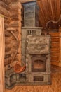Fireplace in the interior of a wooden house Royalty Free Stock Photo
