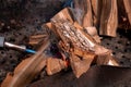 Fireplace kindling of chopped wood logs by gas torch. Method of firing at camping outdoor. Close up image of burning woods and Royalty Free Stock Photo