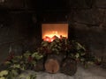 Fireplace lit with burning wood flame. general plan Royalty Free Stock Photo