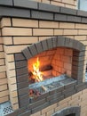 Fireplace made of bricks beautiful view of a burning fire