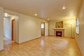 Fireplace and new hardwood floor in empty new house Royalty Free Stock Photo