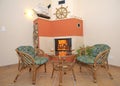 Fireplace and rattan chairs