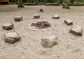 fireplace with stones for sitting in the sand