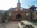 Fireplace and walls remain on crumbled desert house