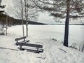 Fireplace with wooden benches in winterly northern Sweden