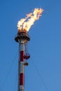 Firer on the top of the tower of the petrochemical industry in a refinery in Tarragona, Spain