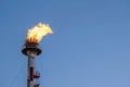 Firer on the top of the tower of the petrochemical industry in a refinery in Tarragona, Spain