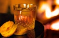 Fireside drink with pastries Royalty Free Stock Photo