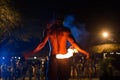 Firestarter performs a stunning fire show at night on the street. Royalty Free Stock Photo