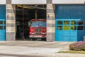 Firestation House with firetruck in open bay