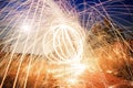 Firetrail of sparks flying through the air creating fire trails Royalty Free Stock Photo