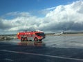 Firetruck on airport at blue sky background