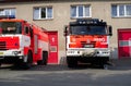 Firetruck and fire engine are parking in front of fire station