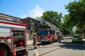 Firetruck and fireman in a residential street for a fire