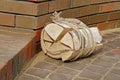 Firewood bundle tied with a rope on the pavement