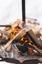 Firewood burning inside the fire-pit during cold winter day Royalty Free Stock Photo
