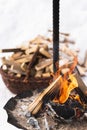 Firewood burning inside the fire-pit during cold winter day Royalty Free Stock Photo