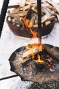 Firewood burning inside the fire-pit during cold winter day Royalty Free Stock Photo