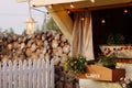 Firewood-filled shed in a neat backyard