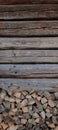 Firewood in front of a tree wallof a barn Royalty Free Stock Photo