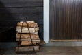 Firewood next to the open door to the traditional Finnish sauna Royalty Free Stock Photo