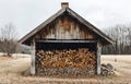 Firewood. Old wooden shed with firewood in the countryside Royalty Free Stock Photo