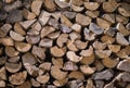 Firewood prepared for storage, stack of dry wooden logs Royalty Free Stock Photo