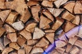 Firewood round stacked under the wall. A pile of wooden logs. Royalty Free Stock Photo