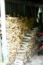 Firewood stacked in a shed Royalty Free Stock Photo