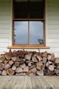 Firewood stacked under window