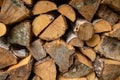 Firewood texture - pile of wood stacked in a woodshed