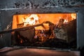 Firewood wood burn in retro rusty rural metal stove