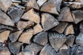 Firewood in woodpile, prepared for Winter. Pile of firewood. The firewood background. A stack of neatly stacked, dry firewood outd