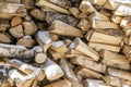 Firewood in woodpile. Wooden background.