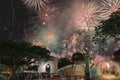 Firework display with people celebrating New Year in downtown Singapore Royalty Free Stock Photo