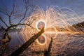 Firework and fire swing on dead tree fourground Royalty Free Stock Photo