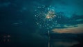 Firework over the blue sky at night, white, and green Royalty Free Stock Photo